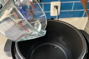 água na panela de pressao
